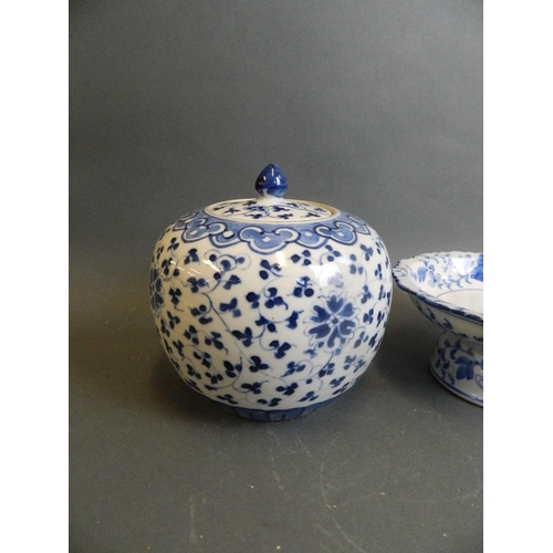 350J - An Oriental blue and white porcelain tazza with frilled rim and floral decoration, together with a b... 