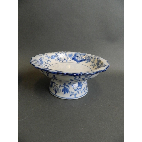 350J - An Oriental blue and white porcelain tazza with frilled rim and floral decoration, together with a b... 