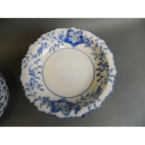 350J - An Oriental blue and white porcelain tazza with frilled rim and floral decoration, together with a b... 