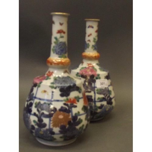 350Q - A pair of Oriental mallet shaped porcelain vases with bright enamel decoration depicting chrysanthem... 