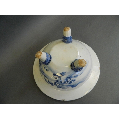 351 - A Chinese blue and white porcelain bowl decorated with fishermen in a boat on a lake, on three kylin... 