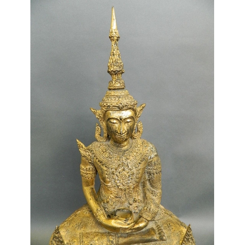 361 - A large C19th Thai gilt bronze figure of Buddha seated on an ornate throne, 21