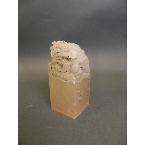 37 - A Chinese white hardstone seal with carved dragon knop, 4 character mark to side, 4