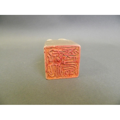 37 - A Chinese white hardstone seal with carved dragon knop, 4 character mark to side, 4