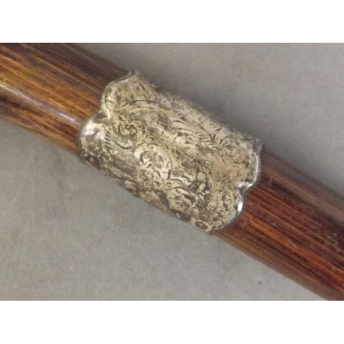 375C - A bamboo parasol handle with Hallmarked silver band, 11