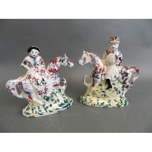 375T - A pair of C19th Portobello figures of riders on horseback decorated in bright enamels, 6½