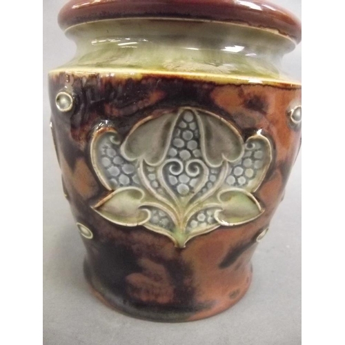 375Z - A Royal Doulton stoneware tobacco jar with dimpled sides, impressed with Art Nouveau leaf designs, w... 