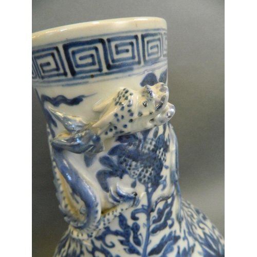 376 - A Chinese blue and white porcelain vase with bulbous base and scrolling vine and applied dragon deco... 