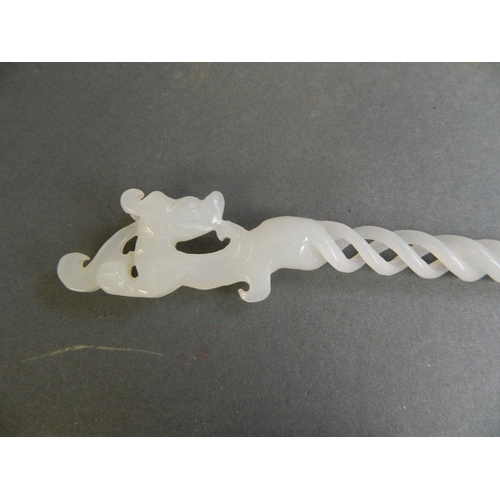 380 - A Chinese white jade hairpin with pierced spiral decoration to stem and carved dragon handle, 9½