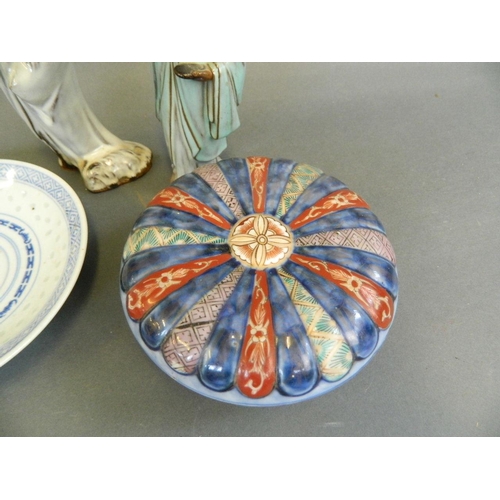 384 - An Imari porcelain squat bowl and cover of ribbed design decorated in traditional colours, together ... 