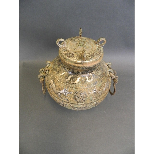 387 - A Chinese Song style mixed metal pot and cover with twin handles and chased tiger decoration, 8