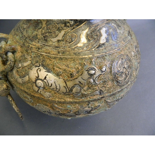 387 - A Chinese Song style mixed metal pot and cover with twin handles and chased tiger decoration, 8