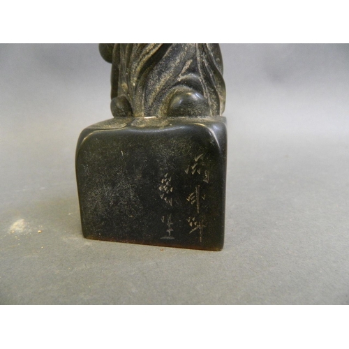 39 - A Chinese black soapstone seal carved in the form of Yue Lao, seal mark verso, 5½