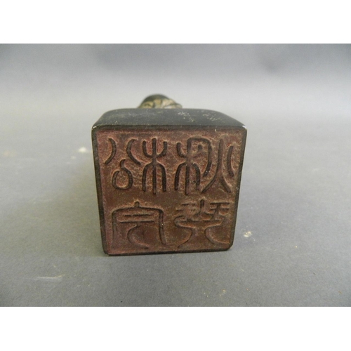 39 - A Chinese black soapstone seal carved in the form of Yue Lao, seal mark verso, 5½