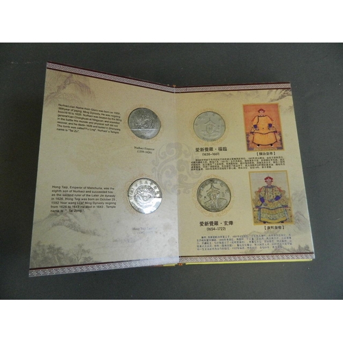 402 - A Chinese presentation album containing facsimile coins commemorating the emperors of China from the... 