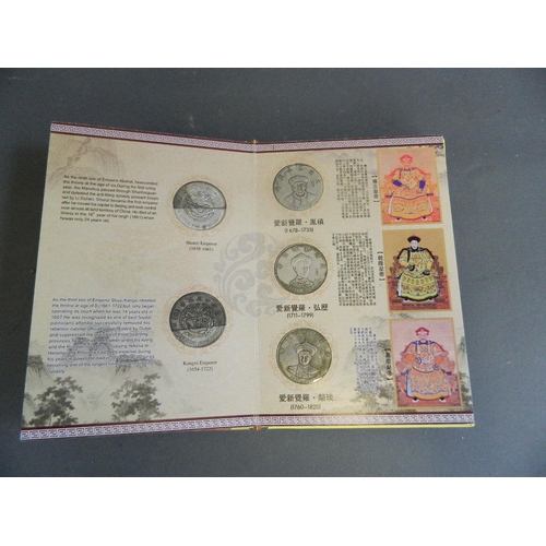 402 - A Chinese presentation album containing facsimile coins commemorating the emperors of China from the... 