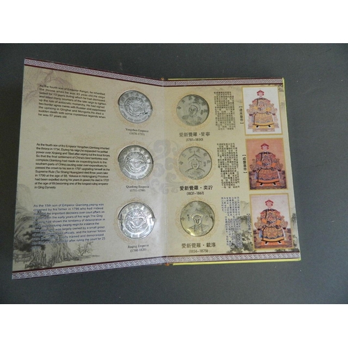 402 - A Chinese presentation album containing facsimile coins commemorating the emperors of China from the... 