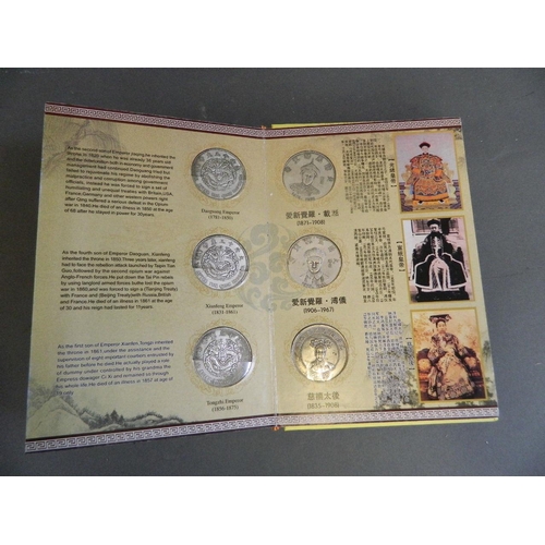 402 - A Chinese presentation album containing facsimile coins commemorating the emperors of China from the... 