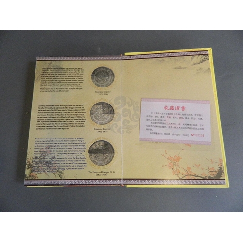 402 - A Chinese presentation album containing facsimile coins commemorating the emperors of China from the... 