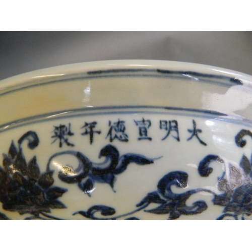 407 - A Chinese blue and white porcelain charger with scrolling lotus flower decoration, 6 character mark ... 