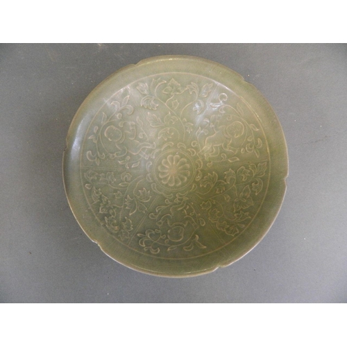 408 - A Chinese green glazed Song style porcelain bowl with incised decoration of boys and flowers, 7½