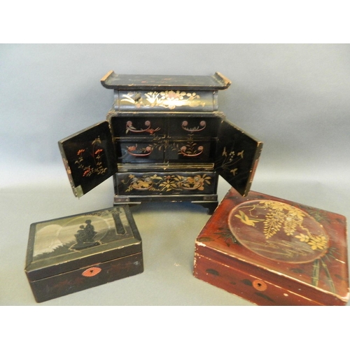 41 - A Japanese lacquer table top jewellery cabinet with fitted drawers, and two lacquer boxes, 11