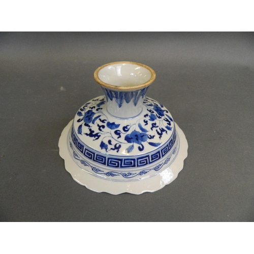 411 - A Chinese blue and white porcelain stem bowl with frilled rim and painted floral decoration, 6½