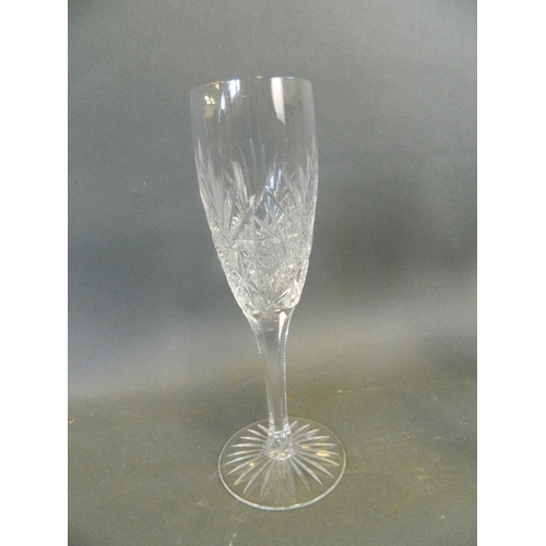 422 - A set of five Stewart art champagne flutes, and two similar flutes, 8