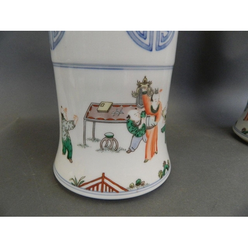 424 - A pair of Chinese famille verte Gu shaped enamel porcelain vases decorated with women and children i... 