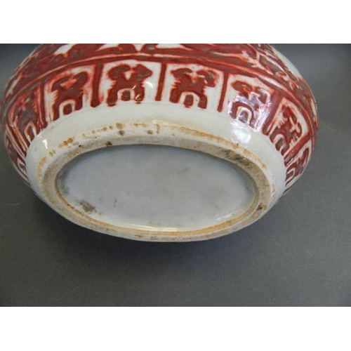 439 - A Chinese red and white twin handled moonflask with incised dragon decoration, 12