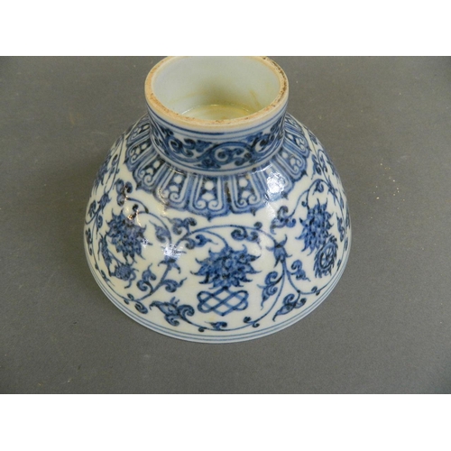 440 - A Chinese blue and white porcelain footed bowl decorated with lotus flowers and Buddhist symbols, 6 ... 