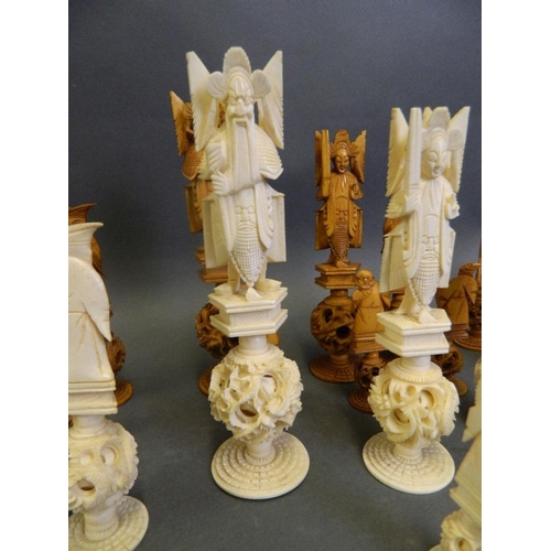 442 - An early C20th Chinese carved ivory chess set, every piece standing on a puzzle ball, king 6½