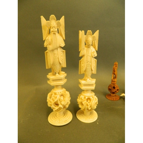 442 - An early C20th Chinese carved ivory chess set, every piece standing on a puzzle ball, king 6½