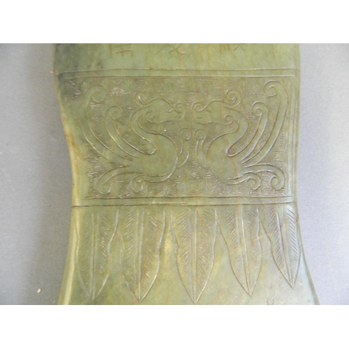 445 - A Chinese archaic green and brown jade tablet with stylised engraved phoenix decoration, 6 character... 