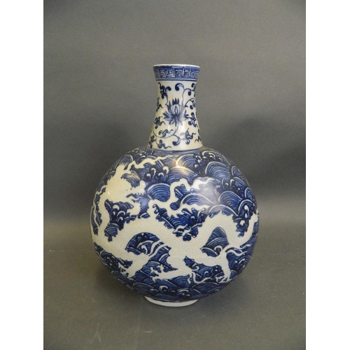 457 - A Chinese blue and white porcelain moonflask with incised dragon decoration, seal mark to base, 12½