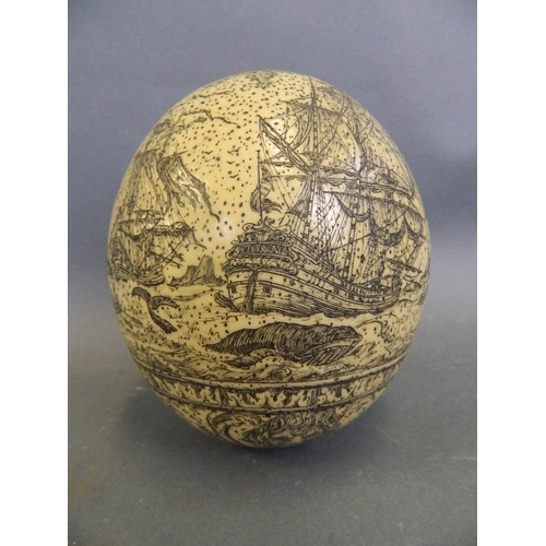 466 - A large Scrimshaw carved egg depicting whaling scenes, 5½