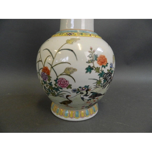 472 - A Chinese polychrome enamel porcelain vase decorated with ducks amongst flowers, seal mark to base, ... 