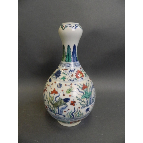 476 - A Chinese Doucai garlic head shaped enamel porcelain vase decorated with carp in a lotus pond, 9½