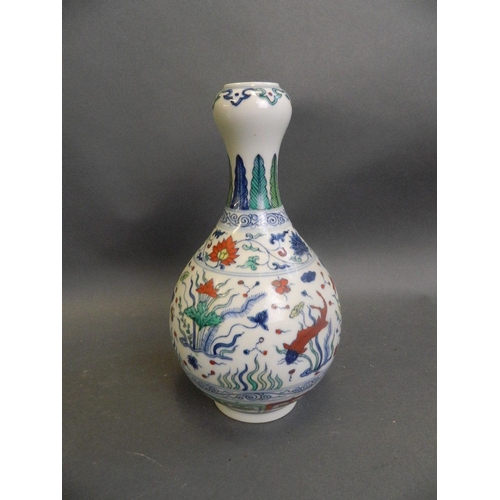 476 - A Chinese Doucai garlic head shaped enamel porcelain vase decorated with carp in a lotus pond, 9½