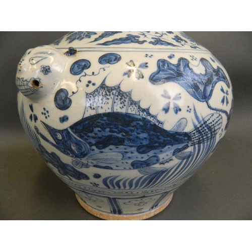 481 - A Chinese Ming style blue and white porcelain bulbous vase with twin mask handles and painted carp d... 