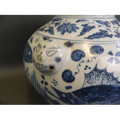 481 - A Chinese Ming style blue and white porcelain bulbous vase with twin mask handles and painted carp d... 