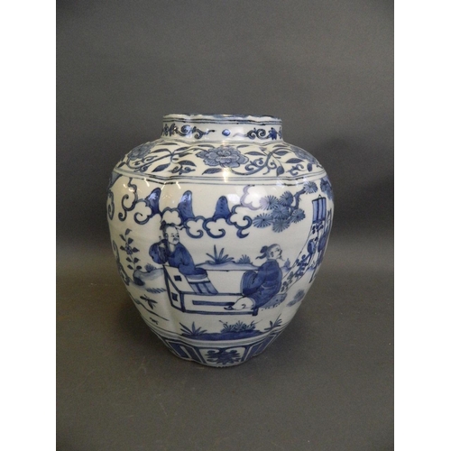 489 - A Chinese blue and white porcelain ribbed vase with painted decoration of figures relaxing in a gard... 