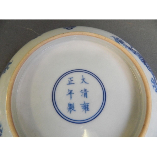 49 - A Chinese blue and white porcelain dish decorated with a dragon chasing the flaming pearl, 6 charact... 