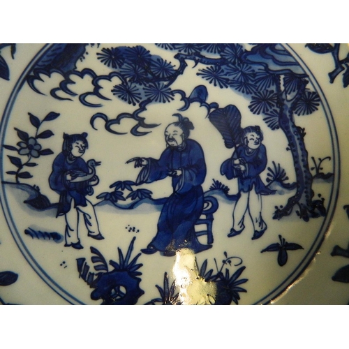 493 - A Chinese blue and white porcelain bowl decorated with a sage and two servants, 6 character mark to ... 