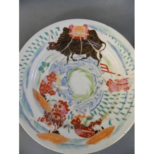 494 - A Chinese porcelain plate with painted decoration of a buffalo and figures, 6 character mark to base... 