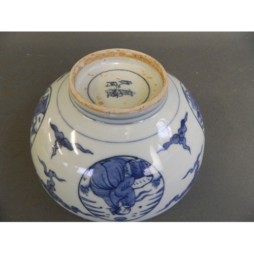 496 - A Chinese blue and white porcelain bowl with decorative panels depicting scholars, 4 character mark ... 