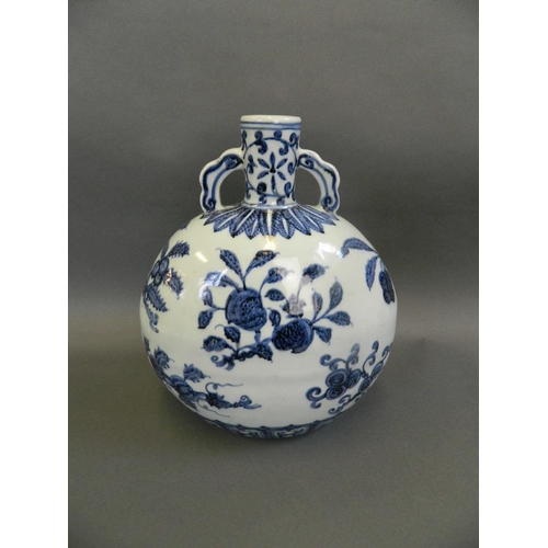 50 - A Chinese blue and white porcelain twin handled moonflask with painted fruiting branch decoration, 6... 