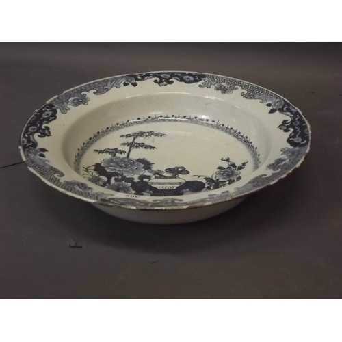 50C - A C19th Delft blue and white bowl with Oriental inspired decoration, 15½