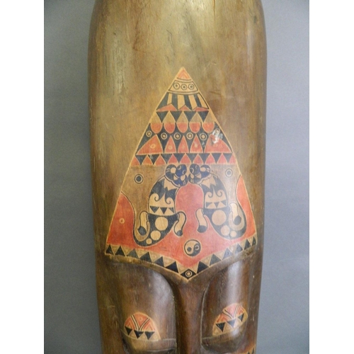 50E - A large African carved wood wall mask with painted animal decoration, c1950, 9½