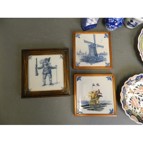 50P - A collection of Delft pottery to include three tiles, two small vases, a Wicca chair ornament, and t... 